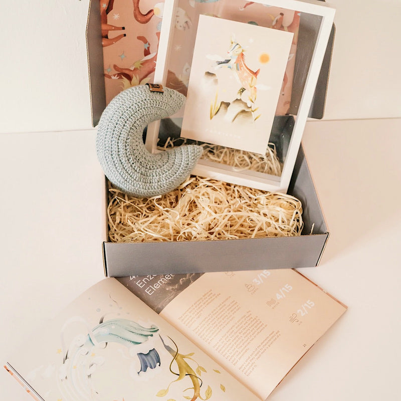 Guide from the Stars gift box with a crochet moon, framed sign illustration and the personalized parenting guide