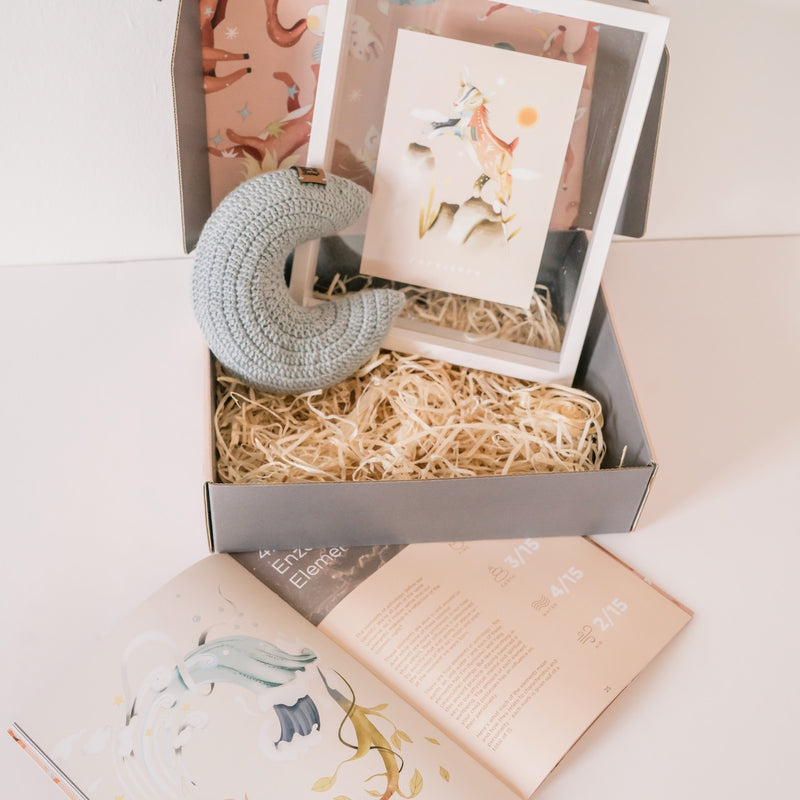 Guide from the Stars gift box with a crochet moon, framed sign illustration and the personalized parenting guide