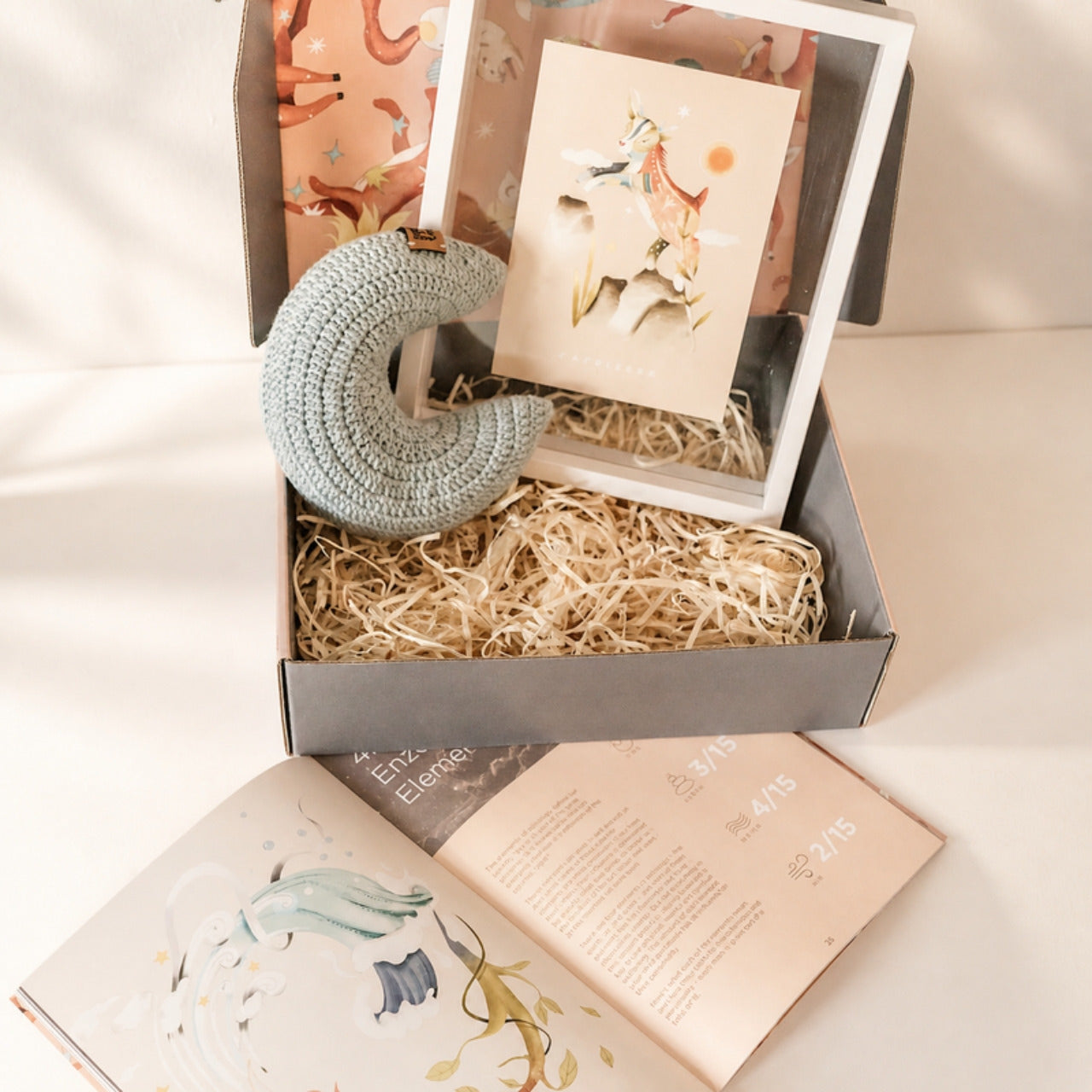 Guide from the Stars gift box with a crochet moon, framed sign illustration and the personalized parenting guide